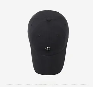 Top-down view of black quick-dry baseball cap with white embroidery and vent holes
