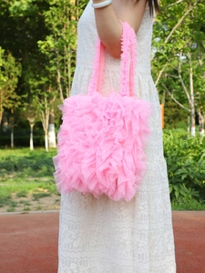 Detailed view of pink mesh handbag featuring romantic layered ruffle pleats for summer style