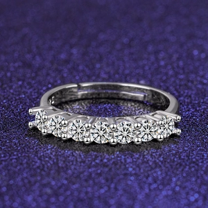 Detail of seven sparkling round-cut stones in a silver classic six-claw prong setting
