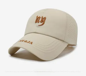 Detail view of beige quick-dry baseball cap with NY embroidery and laser-cut side vents