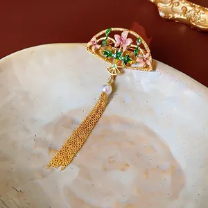 18K gold plated fan brooch with pink enamel floral details, pearl and fringe tassels
