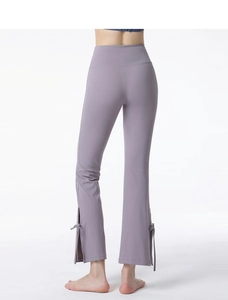 Detail view of high waist yoga pants with lilac side slit and decorative ribbon bow