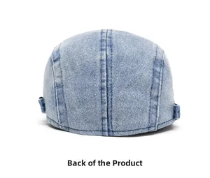 Detailed back view of light blue washed denim newsboy cap with adjustable buckle