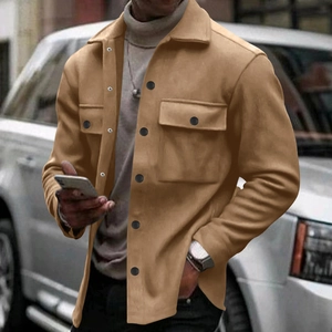 Detail of camel lapel jacket with dual flap pockets and black buttons for men