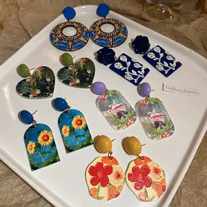 Collection of 6 artistic oil painting style earrings with sunflower and flamingo designs