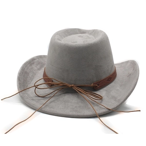 Detail of grey suede cowboy hat featuring brown leather band and intricate stitching
