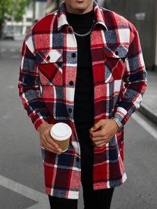 Detail of red and blue checkered long coat with double chest pockets and buttoned cuffs