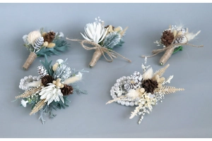 Detail of pine cone boutonniere and wrist corsage set for wedding ceremonies