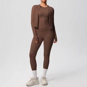 Detail of dark coffee yoga set featuring slim-fit zipper jacket and high-waist leggings