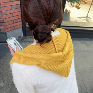 Winter knitted ginger yellow hooded scarf with thick ribbed pattern for women