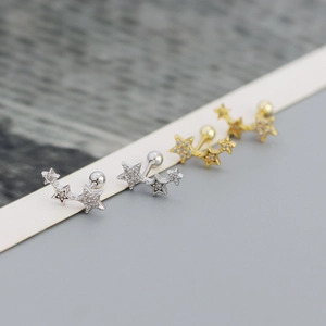 Macro detail of triple star s925 silver stud earrings with cubic zirconia and screw back