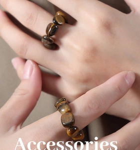 Macro detail of elastic tiger eye stone beaded ring showing natural gemstone texture