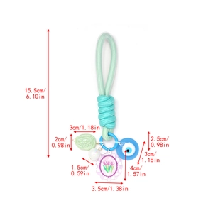 Tableau des tailles détaillé pour porte-clés tressé vert avec œil bleu et fleur