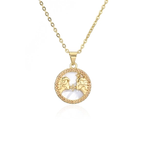 Macro shot of gold constellation necklace with orange cubic zirconia and mother of pearl