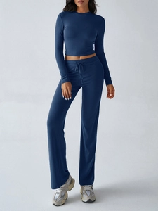 Detail of navy blue Y2K tracksuit featuring cropped long sleeve top and drawstring pants