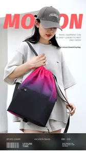 Detail of pink and purple gradient waterproof drawstring bag with front zipper pocket