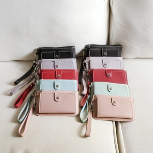 Multiple colorful PU leather coin purses with wrist straps and snap button closures