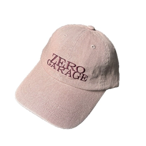 Pink corduroy baseball cap with purple Zero Garage embroidery and a vintage curved brim