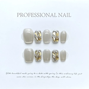 Cat eye press-on nails set with champagne rhinestones and glitter in a square shape