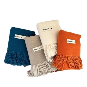 Solid cashmere-like scarves with tassels in blue, gray, cream and orange colors