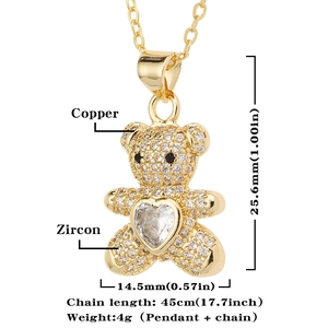 Detailed view of gold teddy bear pendant with zircons and 25.6mm height dimensioning