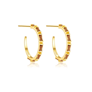 Detail of gold S925 silver C-shaped hoop earrings with inlaid amber rectangle zircons