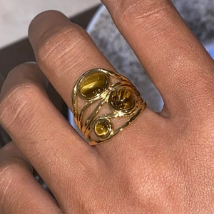 Vintage gold-plated titanium steel ring with layered wave design and tiger eye stone