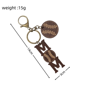 Detail view of Mom wooden keychain with baseball pattern including 14cm size measurements
