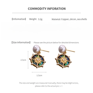 Detailed view of 18k gold-plated star earrings with shell inlay and pearls