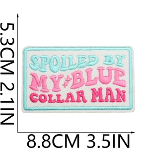 Detail showing dimensions of blue and pink embroidered patch with Spoiled quote text