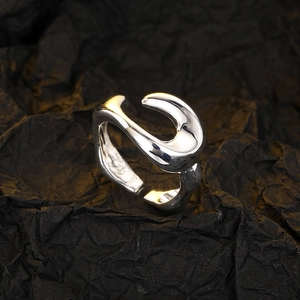 Detailed macro shot of S925 hallmark on the inner band of liquid metal silver ring