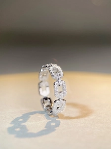 Macro view of silver link ring with full cubic zirconia pavé detailing