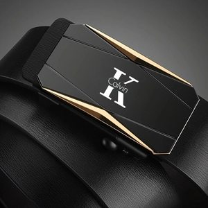 Detail of men's leather belt with black and gold geometric alloy buckle and logo