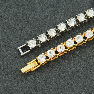 Iced out gold and silver tone Cuban link tennis bracelets with round cubic zirconia stones