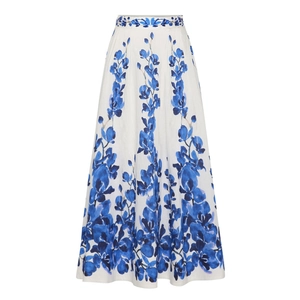 Detail of high-waist A-line maxi skirt with blue floral print and pleated white fabric
