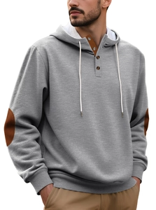 Detail of grey hoodie showing brown elbow patches and buttoned collar with drawstrings
