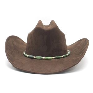 Detailed view of dark brown suede cowboy hat with ethnic style beaded band decoration