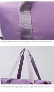 Detail view of reinforced stitching and durable handles on a purple travel bag