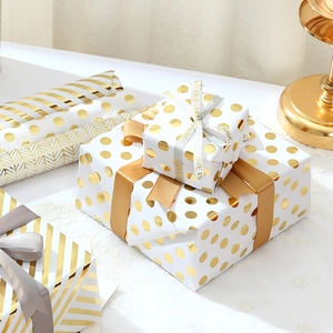 Elegant gold foil stripe and dot gift wrapping paper with champagne silk ribbons