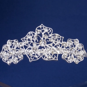 Elegant silver metal crown headband with sparkling crystals and floral filigree patterns
