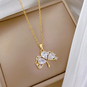 Ginkgo leaf pendant necklace in gold finish with diamonds inside a jewelry box