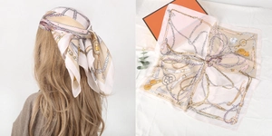 Detail of silk square scarf with horse chain print worn as a headband and flat lay view