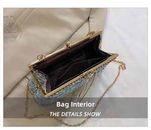 Detailed interior of blue sequin clutch with gold metal frame and dark brown lining