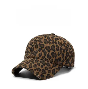Detailed view of leopard print baseball cap with distressed brim and cotton texture