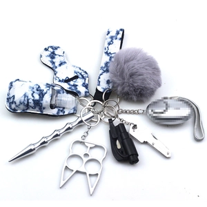 Detail of blue marble neoprene self-defense keychain set with alarm and wristlet