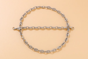 Detailed view of silver pig nose anchor link necklace and bracelet set with metal luster