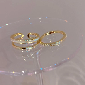 Double-layered gold-plated open ring set with white shell inlay and zircon accents