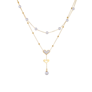 Double-layer gold necklace with white pearl accents and shell heart butterfly pendant