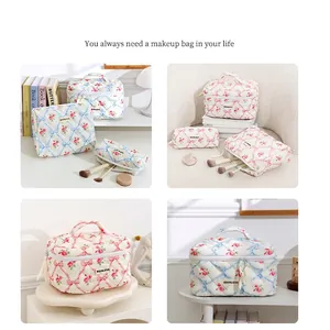 Quilted floral makeup bag set with ribbon print and top handle for organized travel