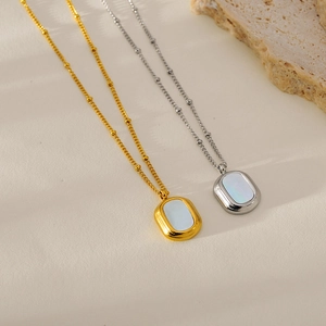 Gold and silver stainless steel necklace with oval white shell pendant on bead chain